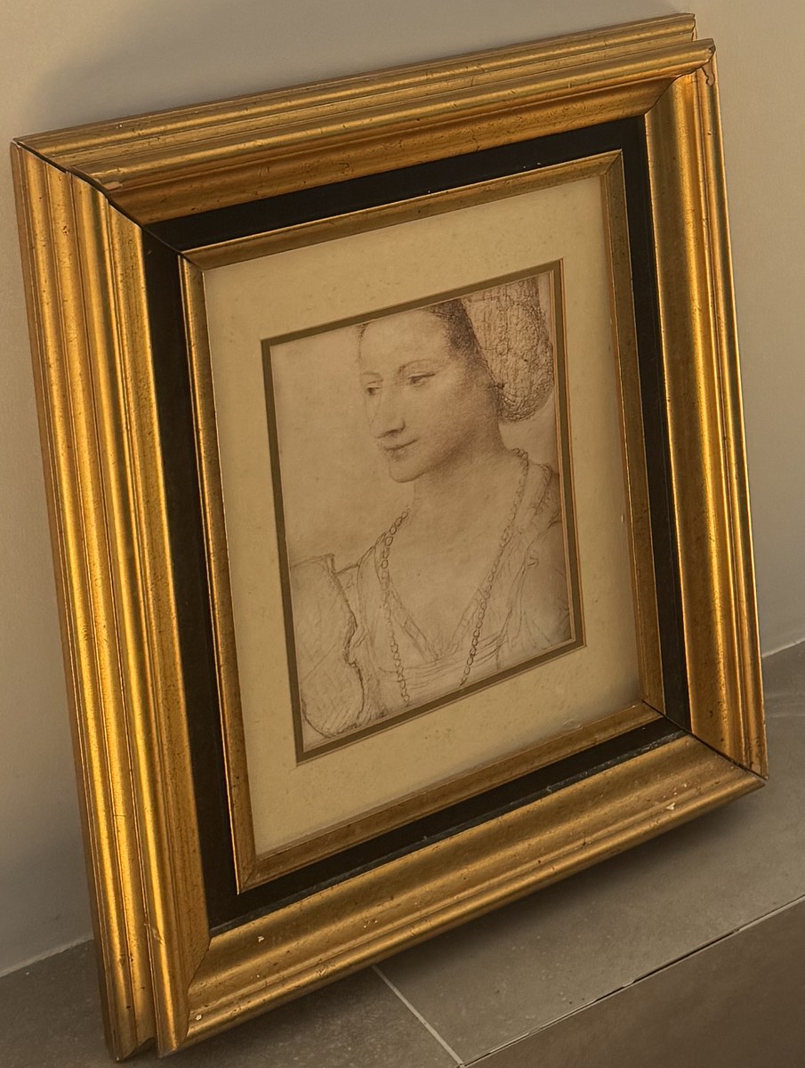 Framed drawing of a young woman in a Renaissance headdress