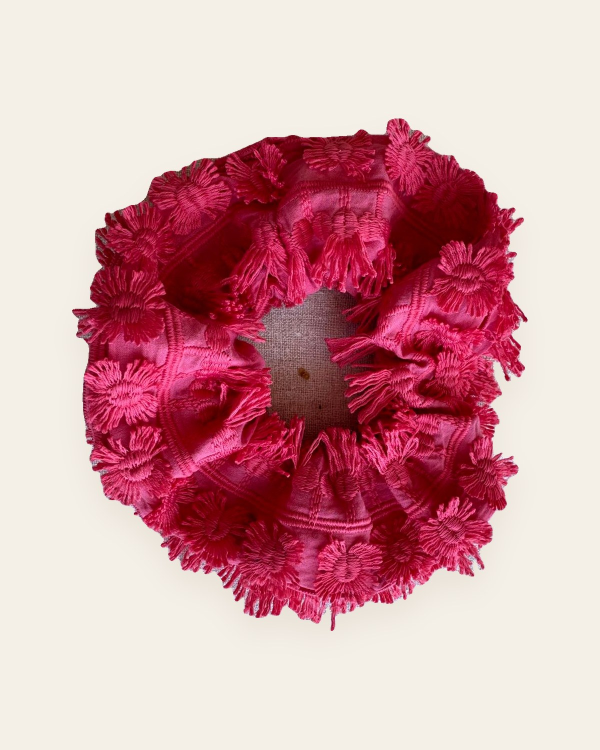 The pink fringed chouchou, worn