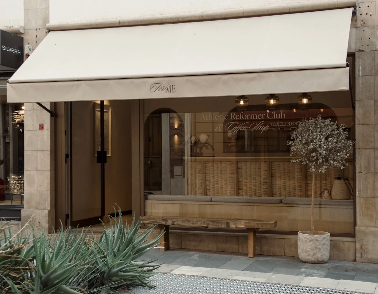 The For/Me shopfront on Rue d'Oran, awning and olive tree